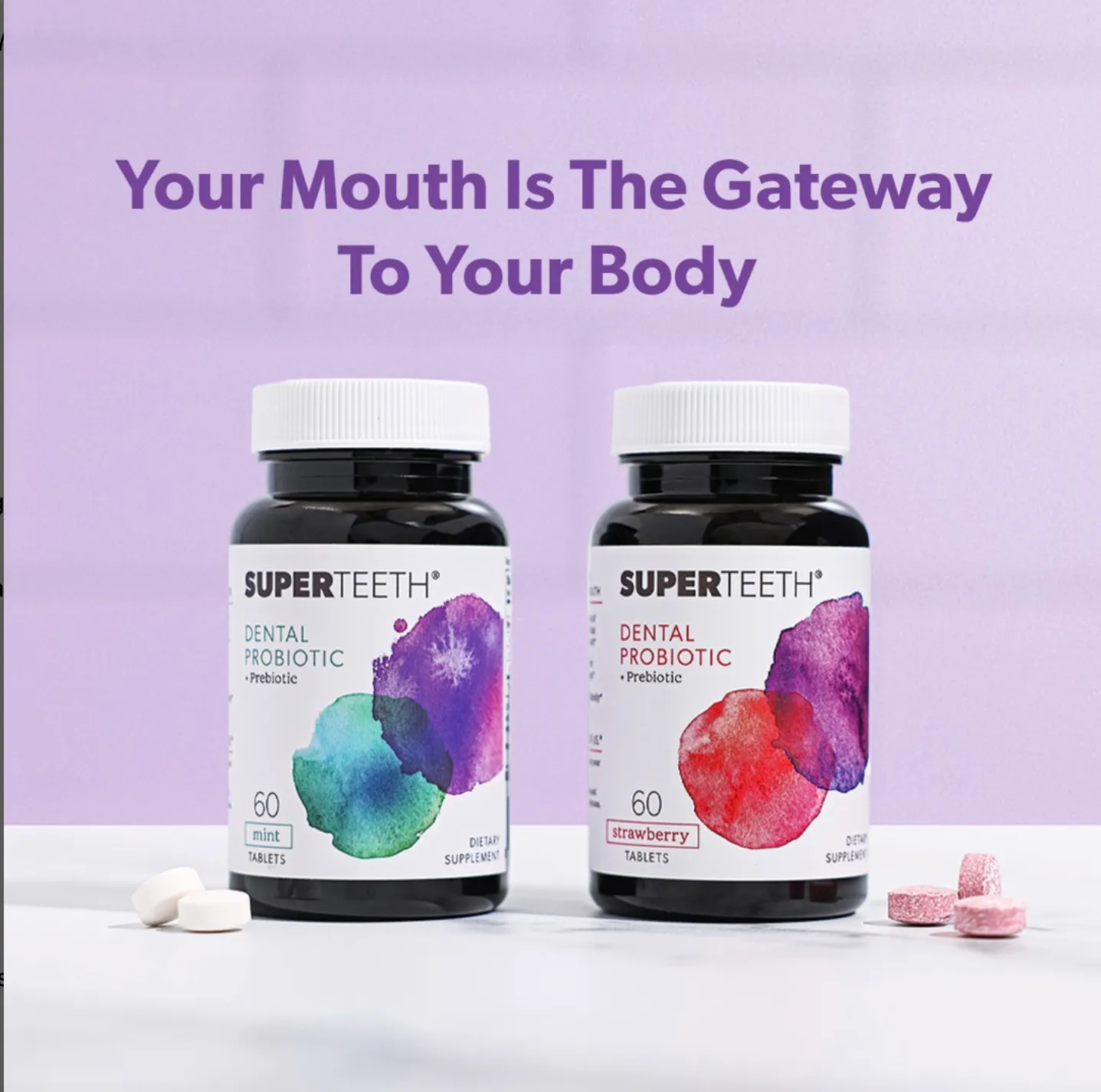 Two jars of SuperTeeth dental probiotic tablets, mint and strawberry, with loose tablets beside them