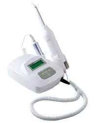 White desktop device with a small screen and a coiled cable to a handpiece